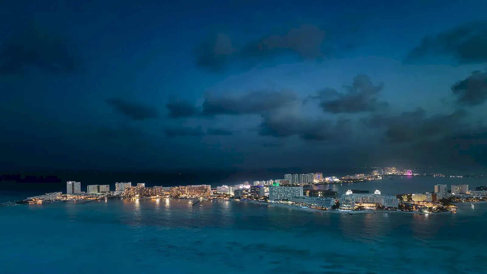 Cancun and Isla Mujeres coastline after dark