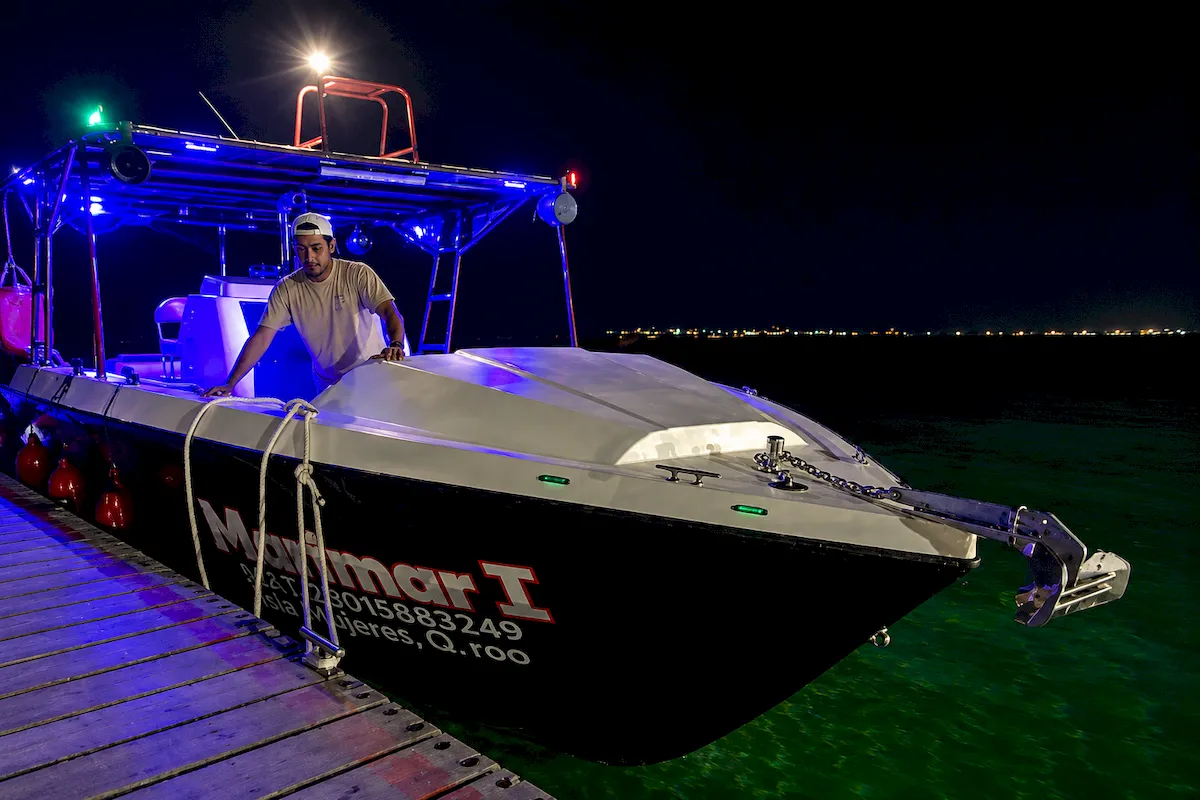 Adventure Tours Isla Mujeres boat ready for a nighttime transfer