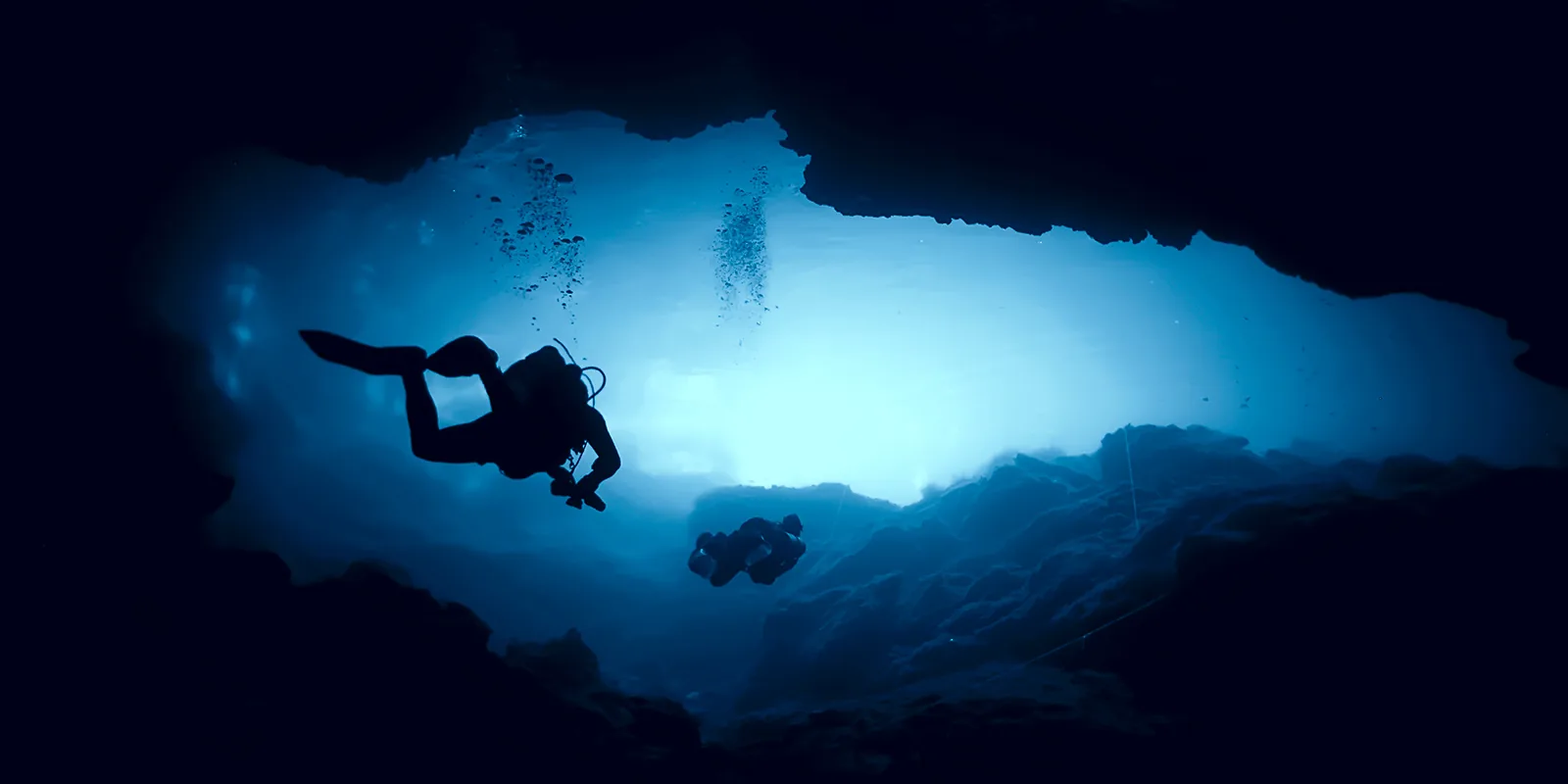 Diver exploring a freshwater cavern in a Yucatán cenote